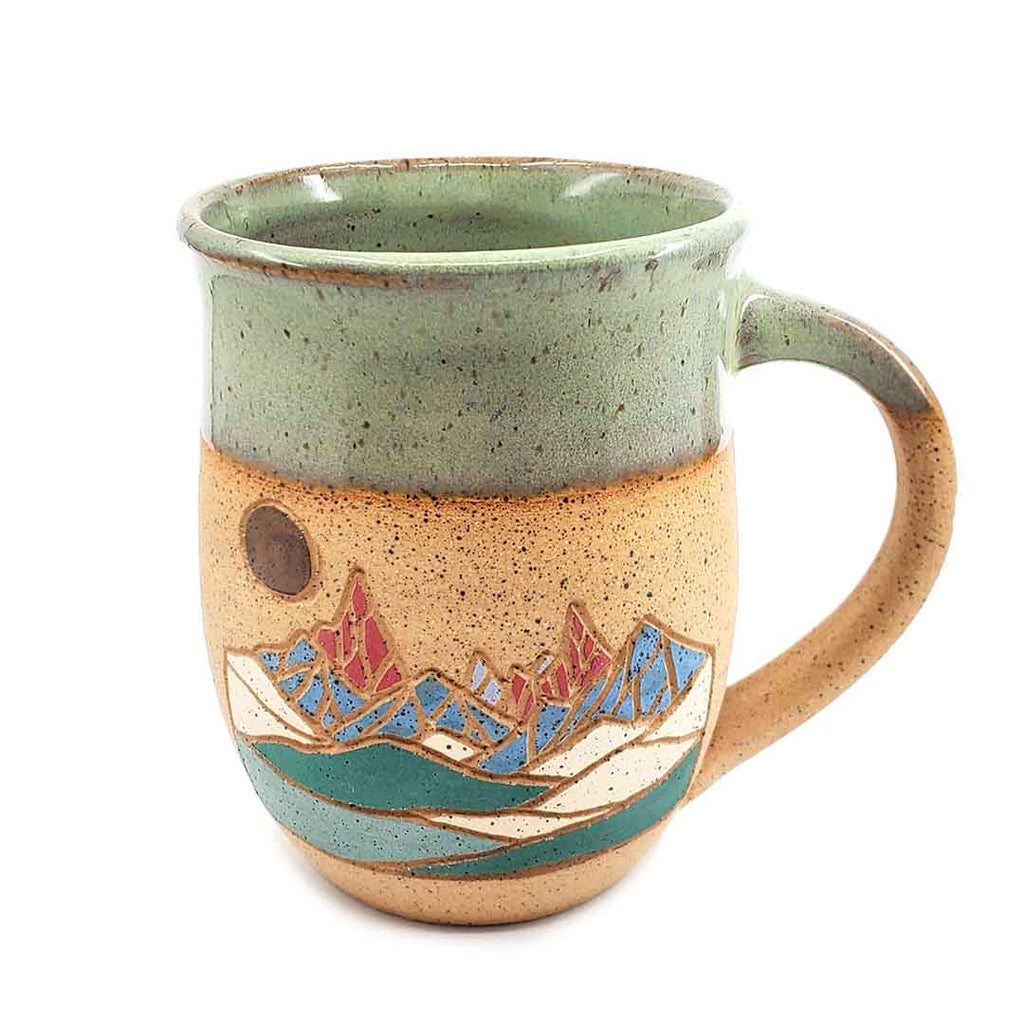 Hand-thrown and carved mountain landscape mug by Forest Jeannie at The Handmade Showroom