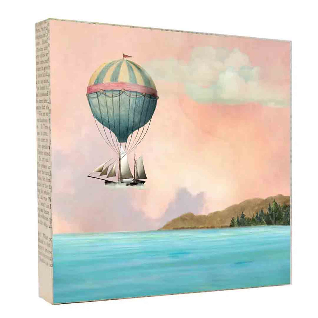 A group of 4 tiny pottery houses with tiny hearts floating above available at The Handmade Showroom in Seattle WA